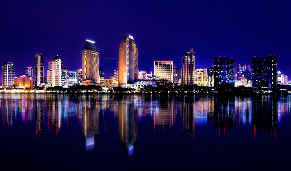 City lights against an evening skyline showcase the home of the best solar company in San Diego.