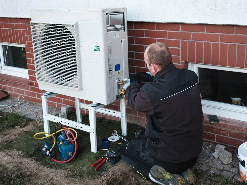 A heat pump installation in process with a licensed HVAC technician.