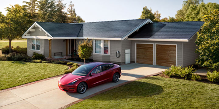 A single story family home with a Tesla Solar Roof and a Tesla Model 3 parked in the driveway